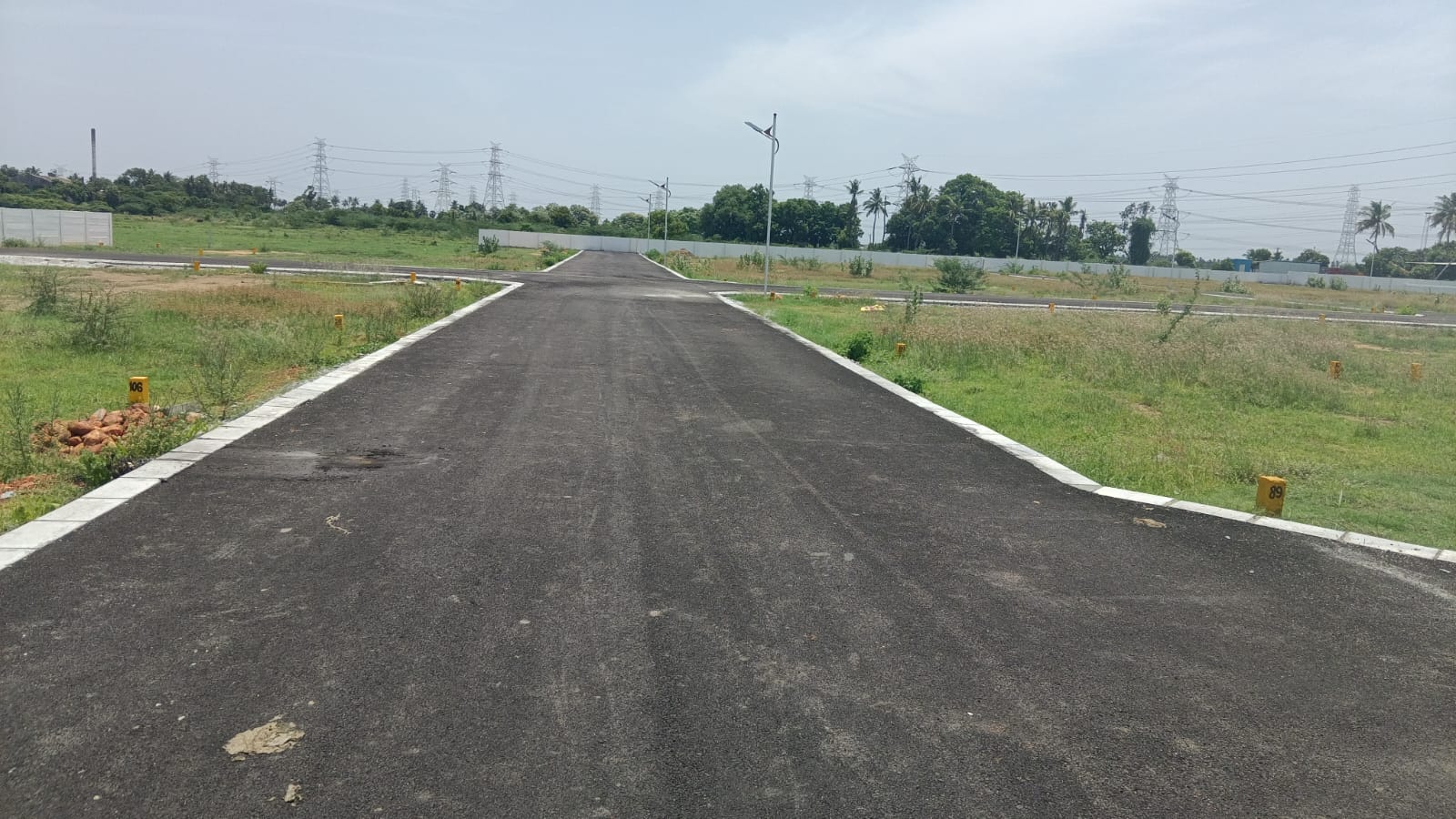 Internal road junction at New Lucky Town with kerbed edges and street lighting